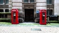 Two Red English Classic Telephone Boxes