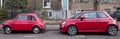 Two red Fiat 500 classic Cinquecento cars parked on a residential street in London UK
