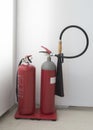Two red fire extinguishers, water and CO2  in stand Royalty Free Stock Photo