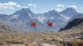 Two Red Flags on a Mountain Landscape Royalty Free Stock Photo