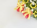 Two red gift boxes with yellow ribbons bow on white background. Royalty Free Stock Photo