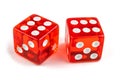 Two red glass dice isolated on a white background. The result is six and six with a slight shadow. Macro photo. Royalty Free Stock Photo