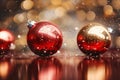 two red and gold christmas balls on a shiny surface Royalty Free Stock Photo