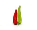 Two red and green chili peppers on a light background. Royalty Free Stock Photo