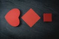 Two red heart boxes and an empty sheet on a black stone background. Royalty Free Stock Photo