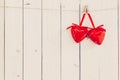 Two red heart hanging on white wood with space for Valentine and Royalty Free Stock Photo