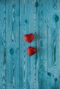 Two red hearts on a blue background with wood texture Royalty Free Stock Photo