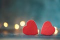 Two red hearts on the blurred dark concrete background.  Happy Valentine`s day. Love concept Royalty Free Stock Photo