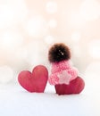 Two red hearts in cap on snow background. couple in love. Valentine`s Day. Red heart on snowy tree branch in winter. Holidays Royalty Free Stock Photo