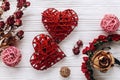 Two red hearts and dried flowers roses on rustic white wooden ba Royalty Free Stock Photo