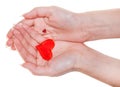 Two red hearts on female palms isolated on white Royalty Free Stock Photo