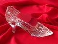 Two red hearts in the glass slipper Royalty Free Stock Photo