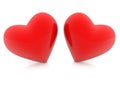 Two red hearts lean against each other