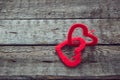 Two red hearts on old shabby wooden background Royalty Free Stock Photo