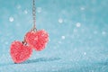 Two Red hearts pendant, valentine day greeting card. Bokeh blue background. Royalty Free Stock Photo