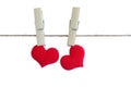 Two red hearts on a rope with clothespins. Love card. clipping path