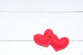 Two red hearts and safety pin on the white background, Valentines day concept Royalty Free Stock Photo