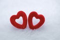Two red hearts in the snow Royalty Free Stock Photo