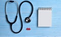 Two Red hearts with stethoscope, blank notepad. Royalty Free Stock Photo