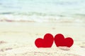 Two red hearts on the summer beach. Royalty Free Stock Photo