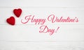 Two red hearts and text Happy Valentine`s Day on white wooden background. Concept for Valentine`s day. Banner Royalty Free Stock Photo