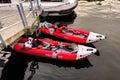 Two red inflatable excursion boats docked at the harbor on the Meuse river in Dinant, Belgium Royalty Free Stock Photo