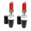 Two red lipsticks Royalty Free Stock Photo