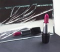 Two red lipsticks, perfect versus imperfect symbolic concept ide