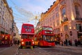 Two red London buses at Piccadilly Circus in London, UK