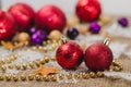 Two red New Year`s Christmas balls on the background of decorations Royalty Free Stock Photo