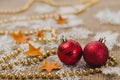 Two red New Year`s Christmas balls on the background of decorations close up Royalty Free Stock Photo