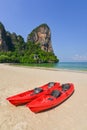 Two Red Ocean Kayaks on Sunny at the beach