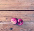 Two red onions on rustic wooden background Royalty Free Stock Photo