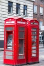 Two red phone booths on the street.. London Royalty Free Stock Photo