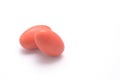 Two red pills on white background with copyspace Royalty Free Stock Photo