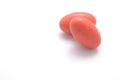 Two red pills on white background with copyspace Royalty Free Stock Photo