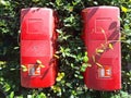 Two red plastic boxes containing fire extinguishers Royalty Free Stock Photo