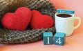 Two Red Plush Hearts Lie In A Cozy Brown Scarf Next To A White Mug Of Black Coffee And A Wooden Calendar With The Date February 14