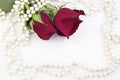 Two Red Roses and Pearls Royalty Free Stock Photo