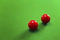 Two red snooker balls on green table Royalty Free Stock Photo