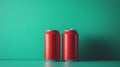 Two red soda cans on green background. Beverage mockup. Royalty Free Stock Photo