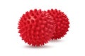 Two red spiny massage balls isolated on white. Concept of physiotherapy or fitness. Closeup of a colorful rubber ball