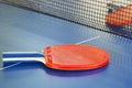 Two red tennis racket on ping pong table Royalty Free Stock Photo