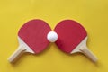 Two red tennis rackets with white ball on it Royalty Free Stock Photo