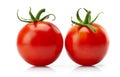 Two red tomato cherry with green leaf. Royalty Free Stock Photo