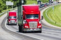 Red Semi Trucks on Highway