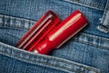 two red turn in blue jeans pocket Royalty Free Stock Photo