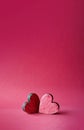 Two red valentines wooden hearts on red background Royalty Free Stock Photo