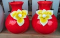 Two red vase standing on a shelf. Home decor, handmade vases for home inerior Royalty Free Stock Photo
