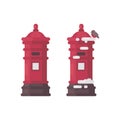 Two red vintage mailboxes with snow. Old postboxes in winter Royalty Free Stock Photo